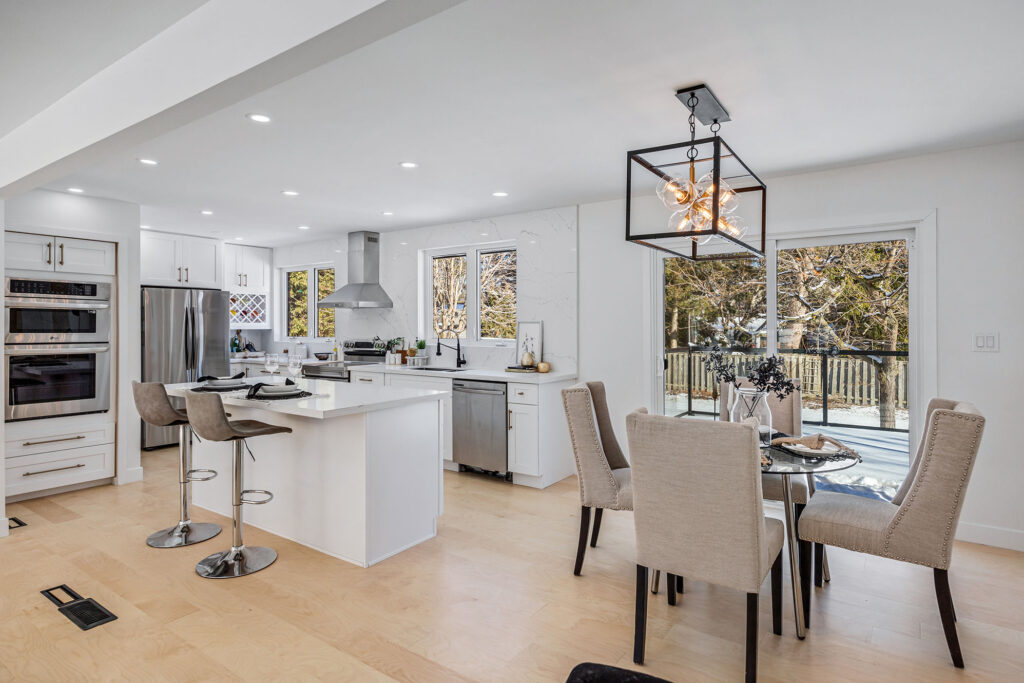 Professionally edited real estate photo of a modern eat-in kitchen.