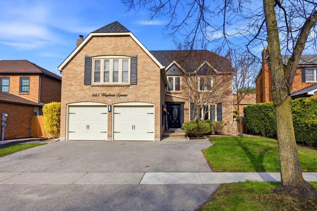 Brick home with a double garage at 661 Weyburn Square in Amberlea, Pickering