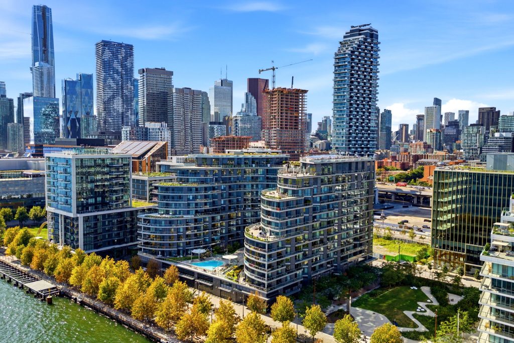 Waterfront condominium exterior and surrounding Toronto skyline at 1 Edgewater Drive