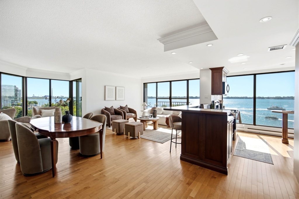 Open living and dining area with waterfront views at 65 Harbour Square, Toronto