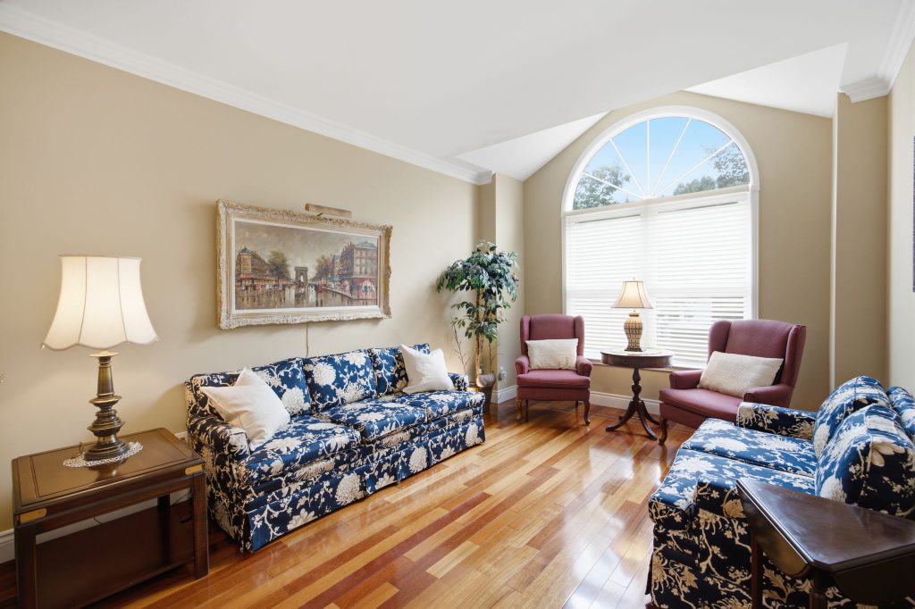 Living room with hardwood floors and an arched window at 34 Kennett Drive, Whitby